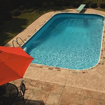 Luxury fiberglass pool installation with custom concrete surround in Arrowcreek, Reno