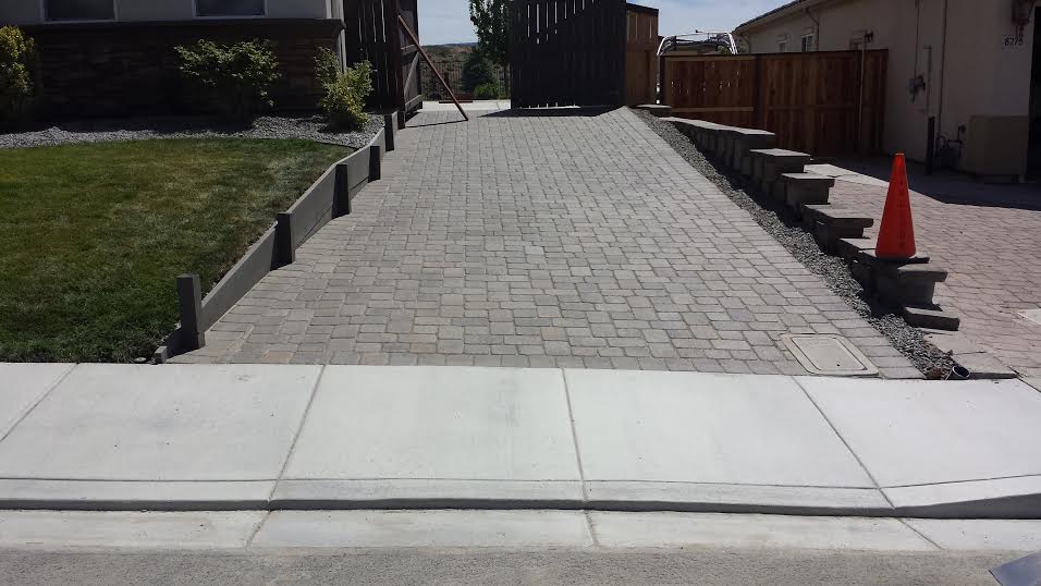 Multi-level paver patio in Arrowcreek, NV. Engineered with reinforced edge restraints and specialized drainage to handle expansive clay soil movement in South Reno.